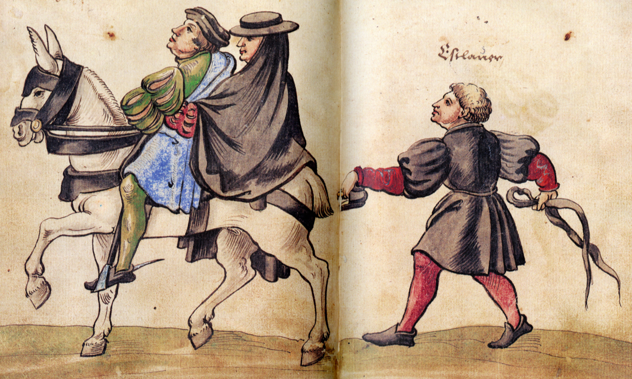Fotografía de un grabado del libro El códice de los trajes (1529), de C. Weiditz. Anotación traducida: “Así pasean a caballo acompañados de sus mujeres en Valladolid”